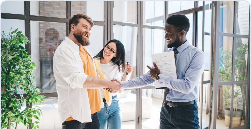 Agent reviewing documents with clients